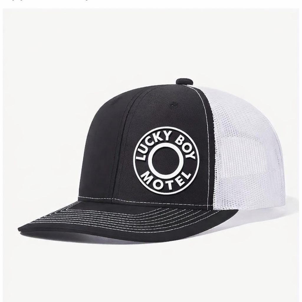 Black Lucky Boy Motel trucker cap with black mesh back.